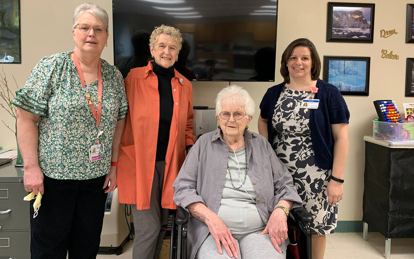 Members from the Rome Twigs joined staff and residents of Rome Health&rsquo;s Residential Health Care Facility to celebrate the installation of a new television, donated by the Twigs, in the facility&rsquo;s activities room. From left: Trudy Guza and Rita Reilley, of the Rome Twigs; Lucille Wick, a resident of the RHCF; and Megan Absolom, RHCF&rsquo;s director of activities.)