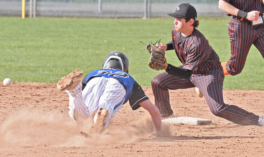 Rome Free Academy&rsquo;s PJ Summa fields the ball from home plate as Camden runner Kolton Kelley slides head first into second base during Monday&rsquo;s game. Summa handled the throw and made the out. Kelly had two hits but RFA won 14-2.