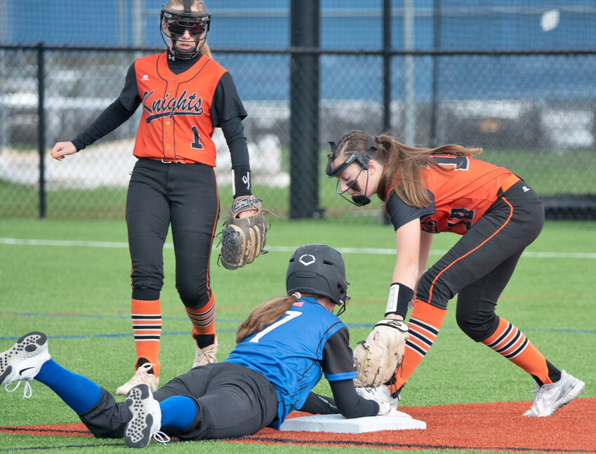 Rome Free Academy shortstop Lex Thompson puts a tag on Camden baserunner Camryn Shenk in Monday's game. Shenk tripled, scored and drove in a run in the Blue Devils' 10-9 comeback win to stay undefeated. Looking on is RFA second baseman Madison Safin.