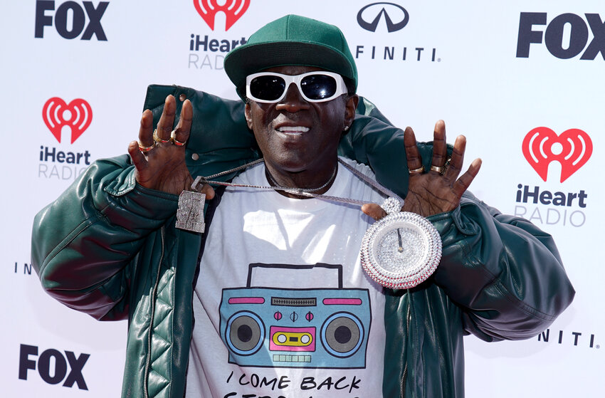 Flavor Flav arrives at the iHeartRadio Music Awards on March 27 at the Dolby Theatre in Los Angeles. The hip-hop legend has been named grand marshal of the International Boxing Hall of Fame&rsquo;s 2023 Parade of Champions scheduled for noon on June 11.