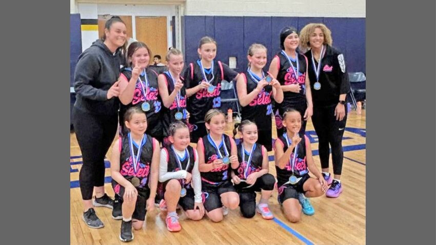 TOURNEY CHAMPS &mdash; The Rome fourth grade select girls basketball team won the Let It Rain Tournament held at Accelerate Sports in Whitestown last weekend with a 16-4 win over the Fulton Lady Raiders on Sunday afternoon in the championship game. Back row from left: coach Nikki Jo Rotolo, Victoria Parra, Shaylee Panych, Anja Dunn, Sophia Passalacqua, Giana Lucas and coach Amya McLeod. Front row from left: Madeline Rutherford, Danielle Medicis, Sydney Relf, Mia Vescio and Olyvia Emery.