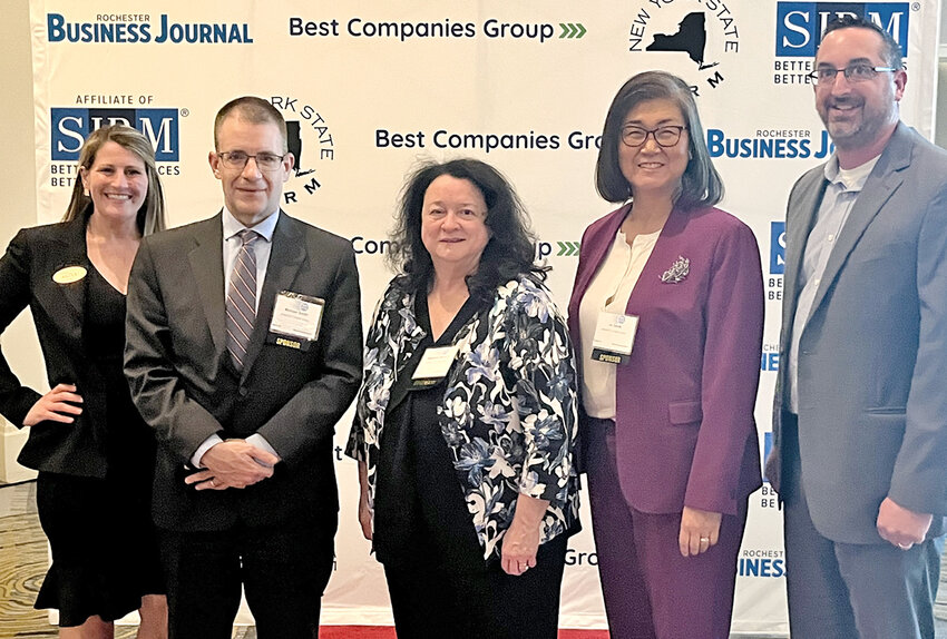 AmeriCU employees receive a Best Company to Work for in New York State award at an annual ceremony. From left: Kristy D&rsquo;Imperio, Mike Smith, Stephanie McGuire, Jin Gwak and Jason Lewin.