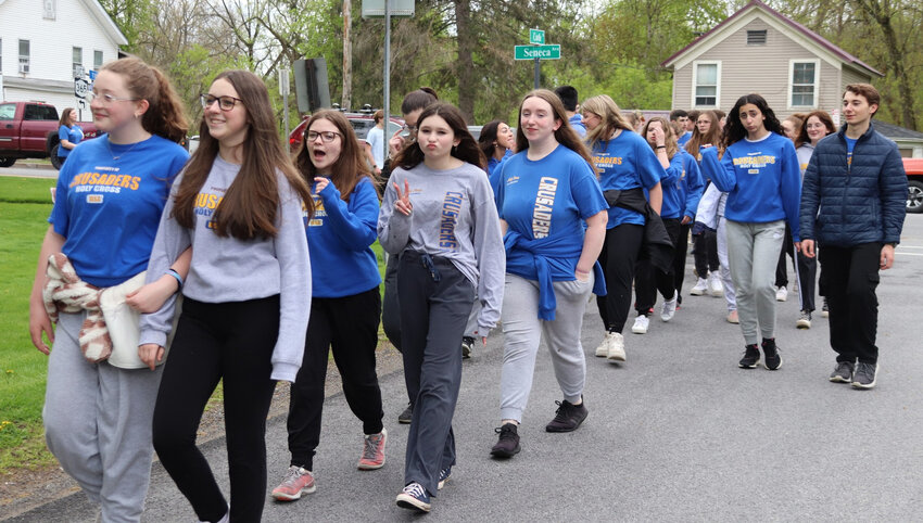 ON A MISSION &mdash; Students and staff at the Holy Cross Academy walk through the city of Oneida as they participate in the third annual HCA Heart Walk on Thursday, May 4. The students and staff used the event, led by HCA&rsquo;s Senior Health Class, to raise funds and awareness for heart disease and stroke. The event is a part of the 2023 America&rsquo;s Greatest Heart Run &amp;amp; Walk event for the American Heart Association, organizers added.