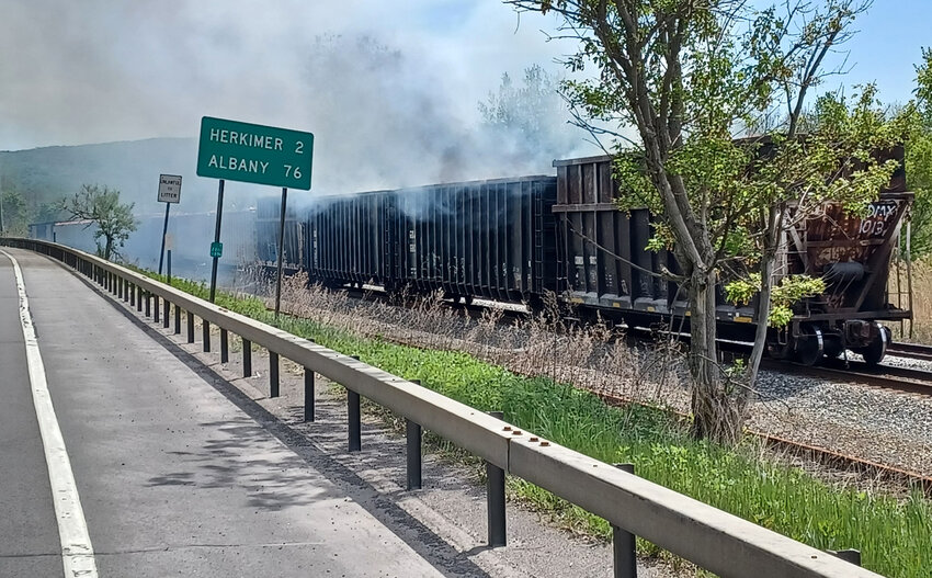 Four train cars all carrying construction debris caught fire near State Route 5 and Ilion on Sunday. There were no hazardous materials involved.