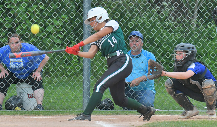 Westmoreland's Olivia Moore swings against Mount Markham at home on Tuesday with catcher Leandra Plows behind the plate. Mount Markham won 9-5.