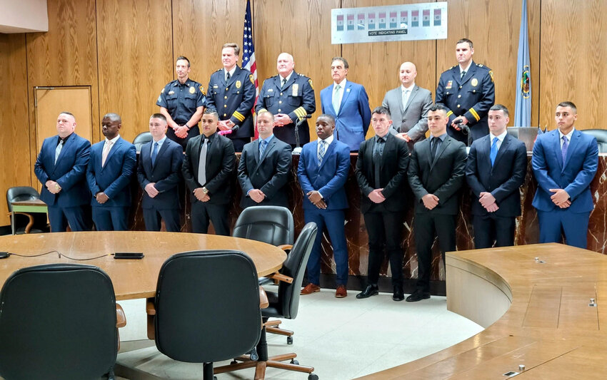 The 10 new recruits to the Utica Police Department pose at City Hall in front of Police Chief Mark Williams, Utica Mayor Robert Palmieri and other department top brass. The new recruits started at the Mohawk Valley Police Academy this week.