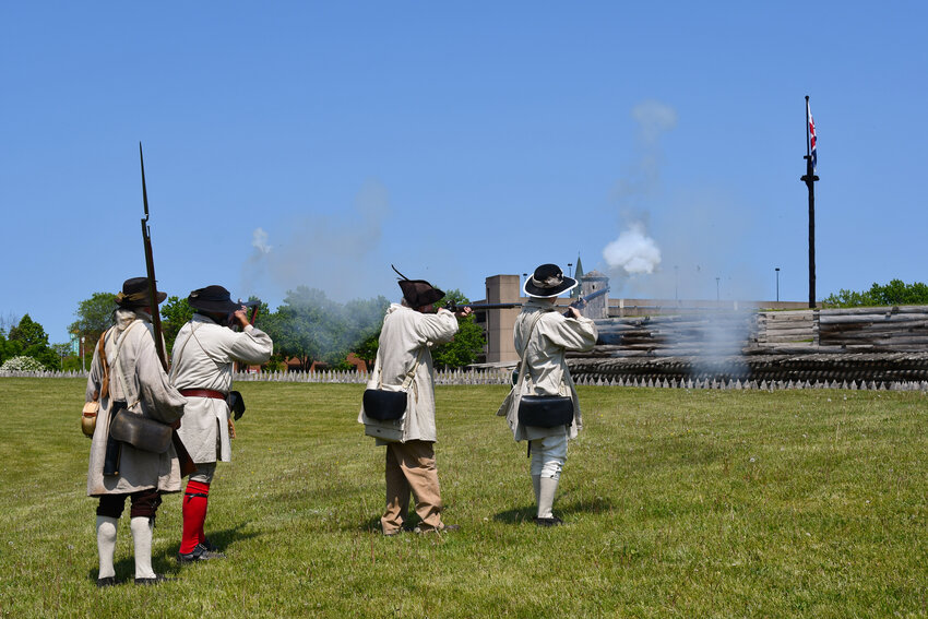 Fort Stanwix staff and volunteers can be seen dressed up in period costume while they tested a bit of powder as they fired their muskets toward the fort during French and Indian War Weekend on Saturday.