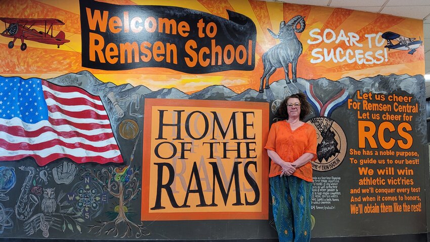 Jodi Richard stands in front of a mural she painted in the Remsen Central School District. The longtime art teacher is retiring after 31 years in the district.