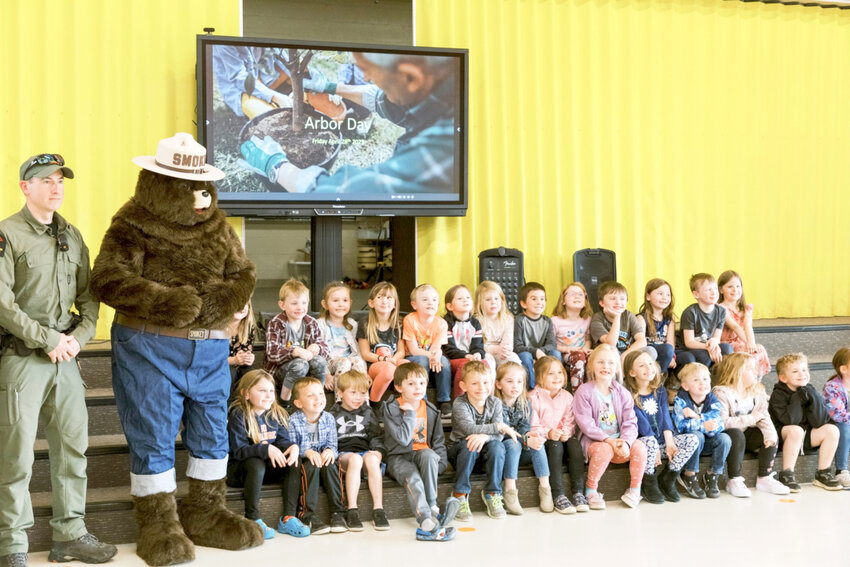 Smokey the Bear, left, joined Remsen elementary students April 28 to celebrate Arbor Day.