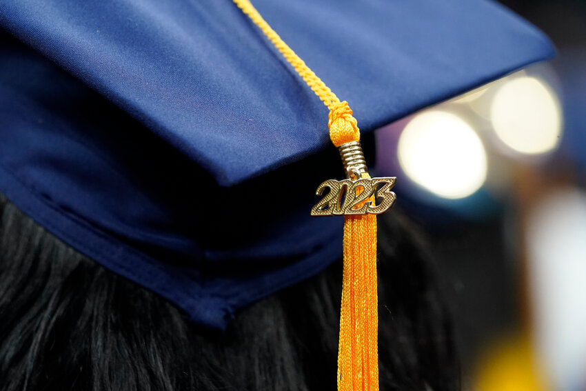 A tassel with 2023 on it rests on a graduation cap as students walk in a procession for Howard University's commencement in Washington, Saturday, May 13, 2023. MBA grads say the investment in their degree was worth it, according to a 2022 survey  by the Graduate Management Admission Council, an association of graduate business schools.