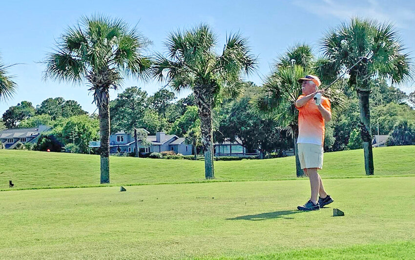Clifford Crandall enjoying a relaxing game of golf while on vacation.