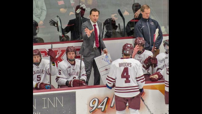Mike Harder is shown on the Colgate bench as an assistant coach. Harder was named as Colgate's head coach on Friday.