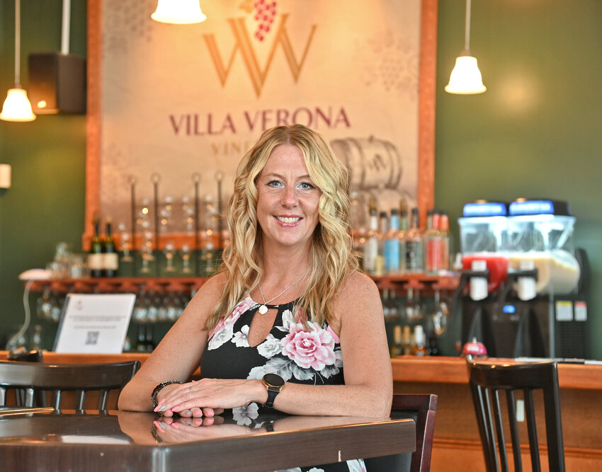 The new owner of Villa Verona Vineyard in Oneida, Amy Rizzuto, pauses for a quick photo  in the Tasting Room Thursday, June 1.