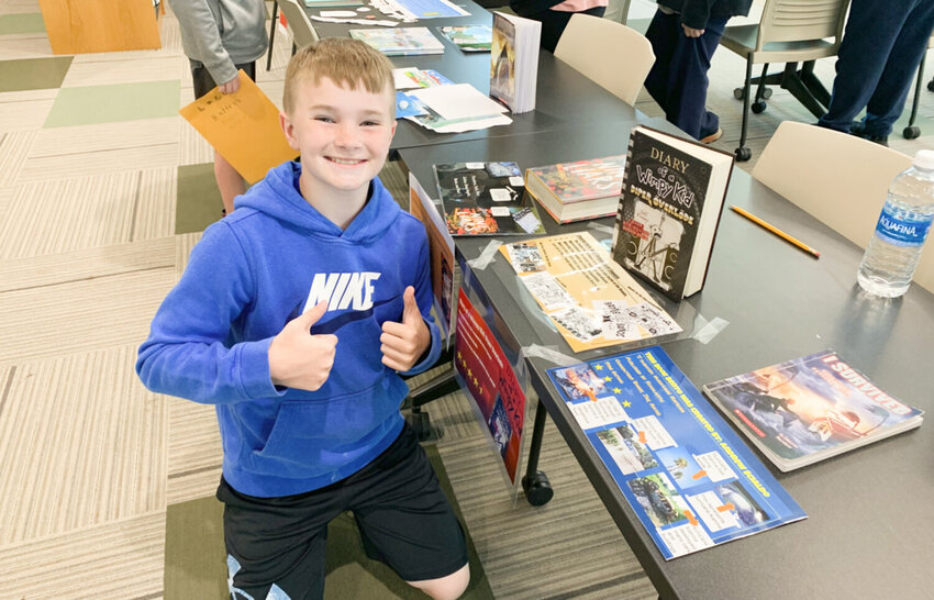 Herkimer Central School District sixth grader Bryce Gargas poses with his &ldquo;Book Bento&rdquo; in the Herkimer Jr./Sr. Library Media Center.