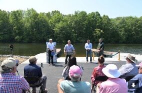 Officials gather for the unveiling of a newly constructed boat launch in Verona. The project will enhances fishing and boating recreational opportunities for all visitors, including people with disabilities, according to the state and local officials.