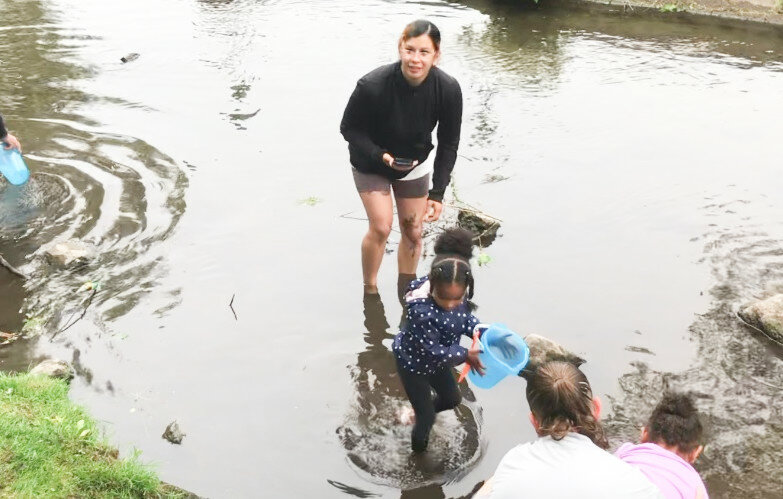 Justine Tucker joined daughter Milani Tucker in the stream Tuesday at Guyer Field in Rome as pre-school students from Denice Luczak&rsquo;s class at Clough Elementary School released trout they raised in their classroom.