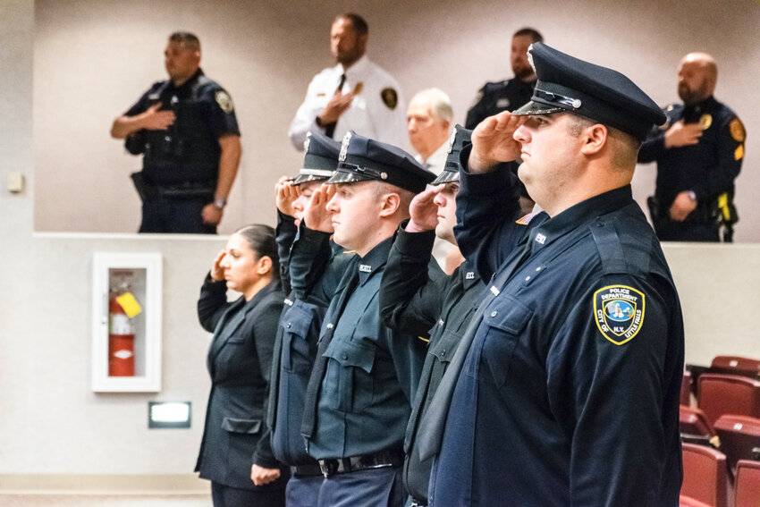 The Pre-Employment Police Academy class of 2023 salutes during the national anthem June 1 at the Herkimer College police academy graduation ceremony.