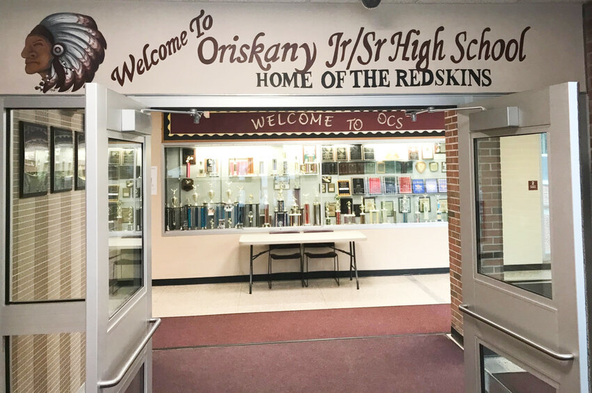 A Native American in feathered headdress and the name of the Redskins are still prominent Tuesday, June 6 in the entrance to the Oriskany Junior/Senior High School in Oriskany.