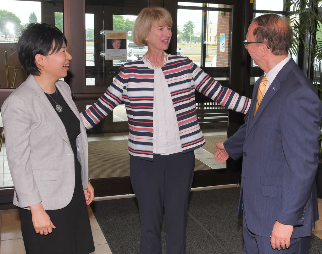WELCOMING THE SUNY CHANCELLOR — SUNY Chancellor Kristina Johnson, center, is greeted by SUNY Polytechnic Institute interim President Jinliu “Grace” Wang, at left, and state Sen. Joseph Griffo upon arriving at Spressos Coffee House at Griffiss park Tuesday afternoon prior to a tour of the nearby Air Force Research Laboratory facility.
 (Sentinel photo by John Clifford)