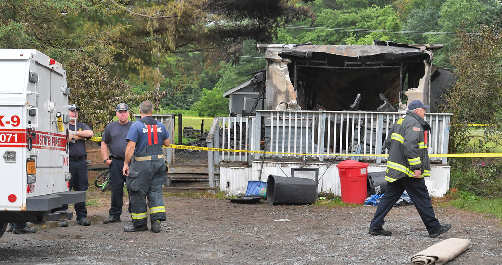 CAUSE UNDER INVESTIGATION — City and state fire investigators will be on scene throughout the day to try and determine a cause for the fatal fire at the Pine Haven mobile home park. The cause would take several weeks to determine, if it is ever determined.
 (Sentinel photo by John Clifford)
