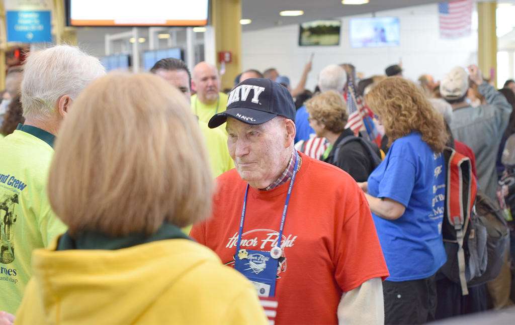 WELCOME TO WASHINGTON D.C. — Korean War Navy vet James A. "Jim" Pirro, of Balswinsville, making his way through the heroes welcome at Washington D.C.'s Reagan National Airport.
 (Sentinel photo by Frank Page)