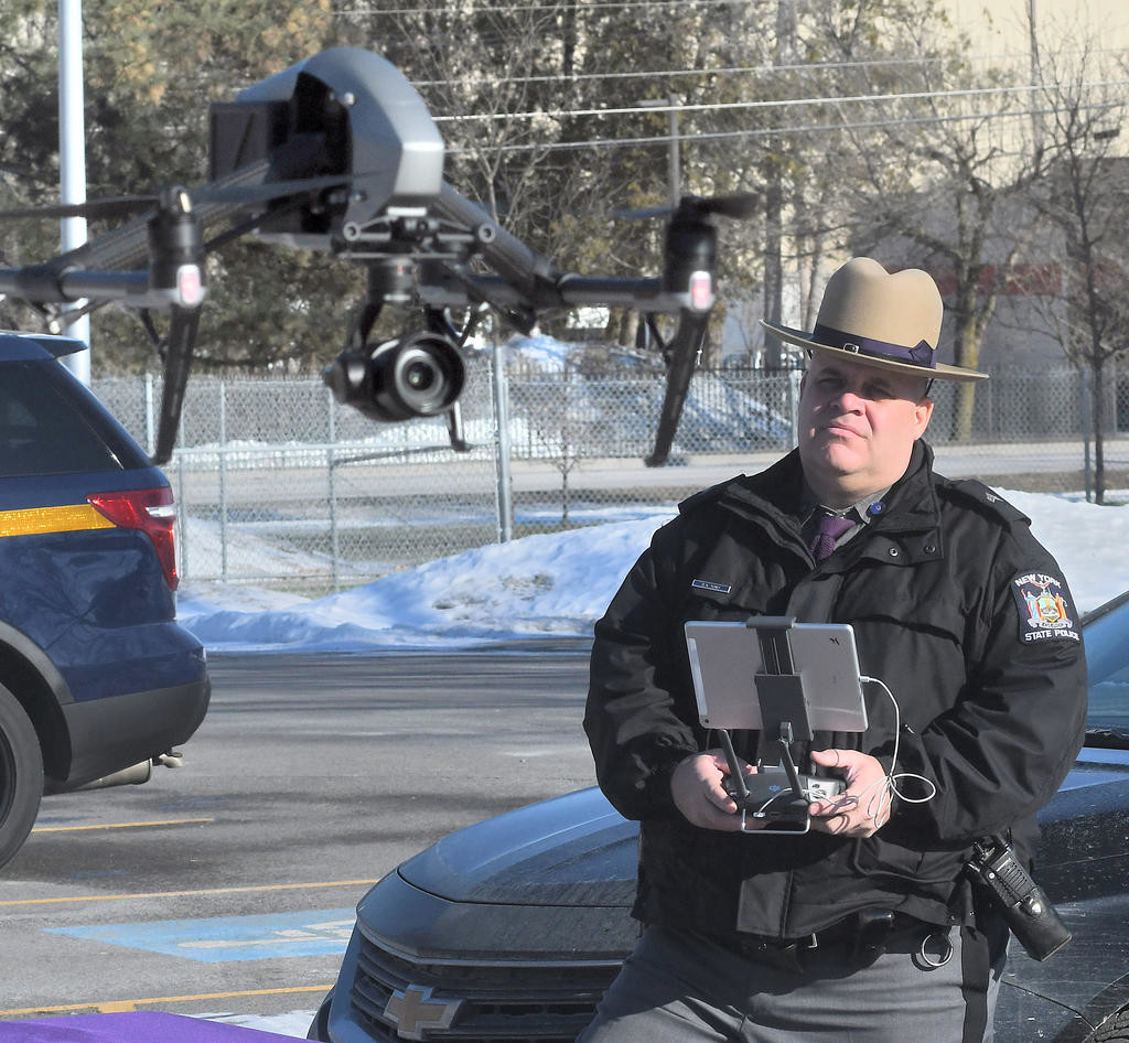 UP, UP AND AWAY — The camera on the front of this new state police drone will help document natural disasters, crime scenes and, in time, motor vehicle accidents. Sgt. David Olney is the pilot.
 (Sentinel photo by John Clifford)