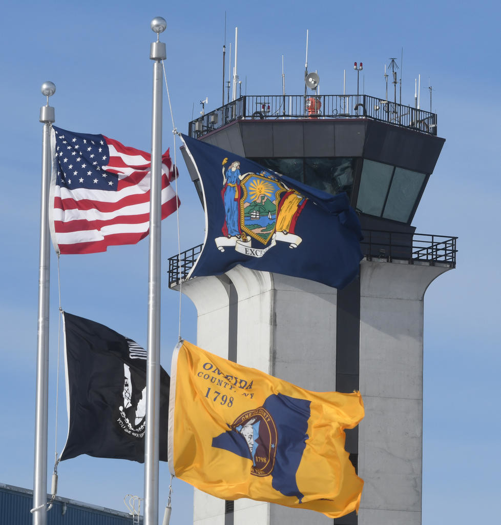 PART OF REGIONAL EFFORT — Flags fly in front of the air control tower at Griffiss International Airport in this file photo. Griffiss is part of a multi-county effort to secure a second headquarters for the online retail giant Amazon.
 (Sentinel file photo by John Clifford)