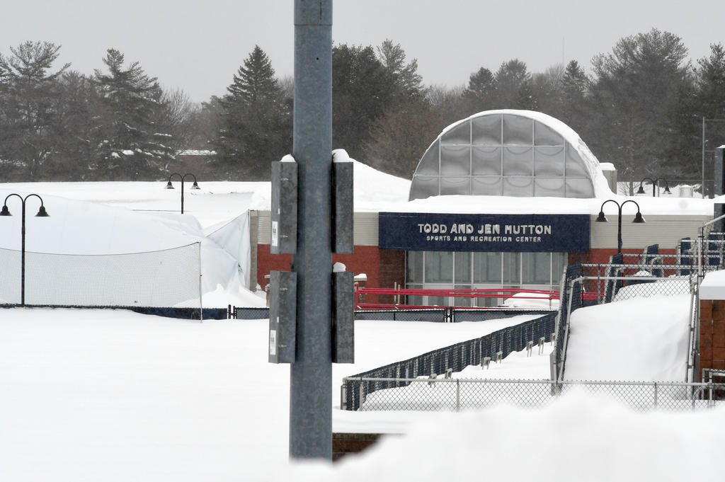 DOME COLLAPSE — The Utica College athletic dome, part of the Todd and Jen Hutton Sports and Recreation Center, sits under a pile of snow this morning after it collapsed around 7:30 p.m. Tuesday.  No one was hurt.  The college said it will work with the dome’s manufacturer to get the facility back up. The college is on spring break this week, 
officials said, so the usually bustling facility did not have its normal schedule of events.
 (Sentinel photo by John Clifford)