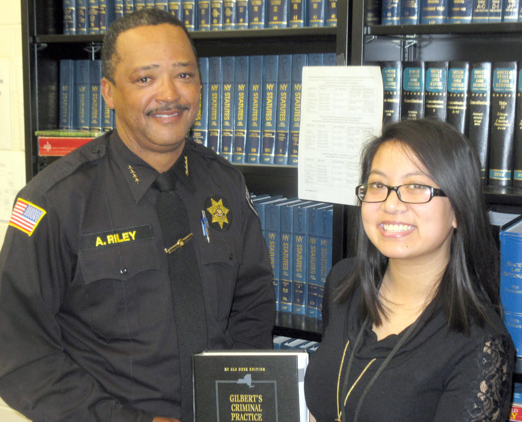 HITTING THE BOOKS — Madison County Sheriff Allen Riley stands with Program Director Elaine Vuong at the inmate library in Madison County’s Public Safety Building. The program helps inmates understand the legal aspects of their case, and is one of several educational programs designed to improve inmates’ lives upon release.
(Sentinel photo by Roger Seibert)
 (Sentinel photo by Roger Seibert)