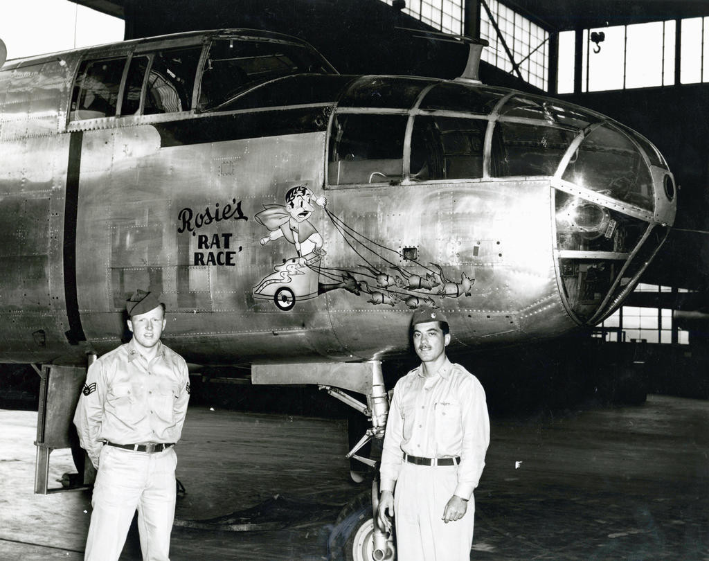 ANGELS ON OUR SHOULDERS — Charlie Pfrimmer, left, poses with Maj. Domenico Curto, Commander of the 1st Radar Calibration Squad, at Griffiss Air Base in the early 1950’s. Pfrimmer’s artwork can be seen on a restored B-29 named “Doc,” after the Snow White Dwarf that Pfrimmer painted on its nose. “Doc” is being rebuilt and made air-ready in Wichita, Kansas.
 (Photo submitted)