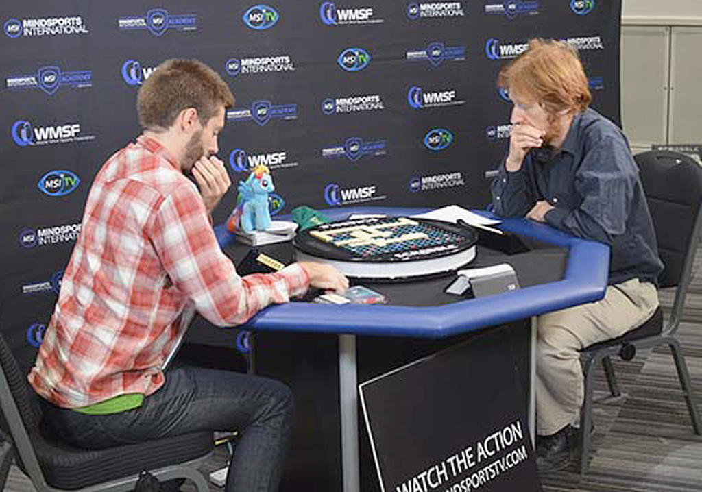 THINKING IT THROUGH — Chris Lipe of Clinton, left, competes against Adam Logan of Canada during the semifinal of the world Scrabble Champions Tournament last month in London. Lipe won that match and wound up finishing second in the competition.
  	               (Photo submitted)