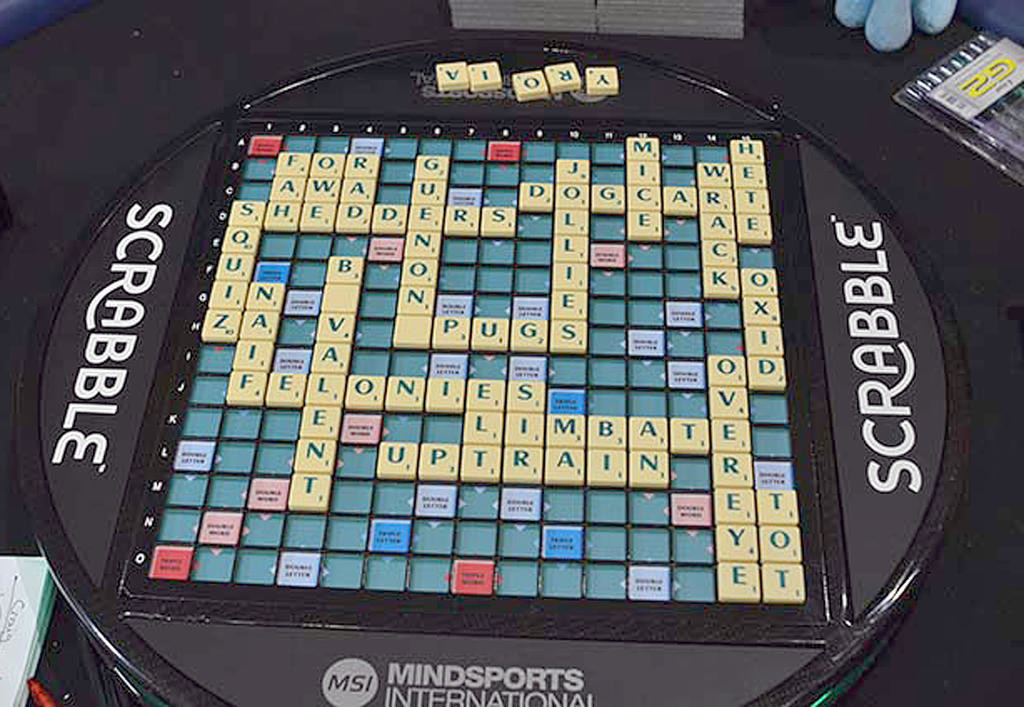 SPELLING A ‘WIN’ — Here is the completed game board from Game 3 of the final round in the world Scrabble Champions Tournament in London. Chris Lipe of Clinton won that game but lost in the final three games to one. Among Lipe’s words: “bivalent,” using a blank tile for “i,” and “guenons,” using a blank tile for “s.” Some of his other plays on the board were “jolies,” “squiz,” “felonies,” and “limbate.”                                                                              (Photo submitted)