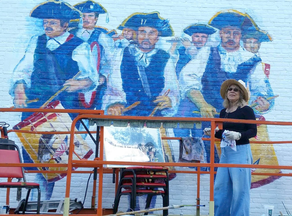 COMING TO LIFE — Members of the Camden Continentals Fife and Drum Corps, and the ancestors who started their legacy 164 years ago, begin to take shape on the VFW wall by the hands of Jane Grace Taylor.
(Photo submitted)