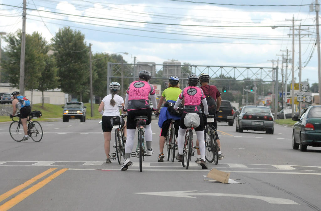 INBOUND — Bicyclists negotiate left hand turn from Erie Boulevard West onto Gifford Road Thursday as they enter the city as part of the 16th annual Cycling the Erie Canal.
