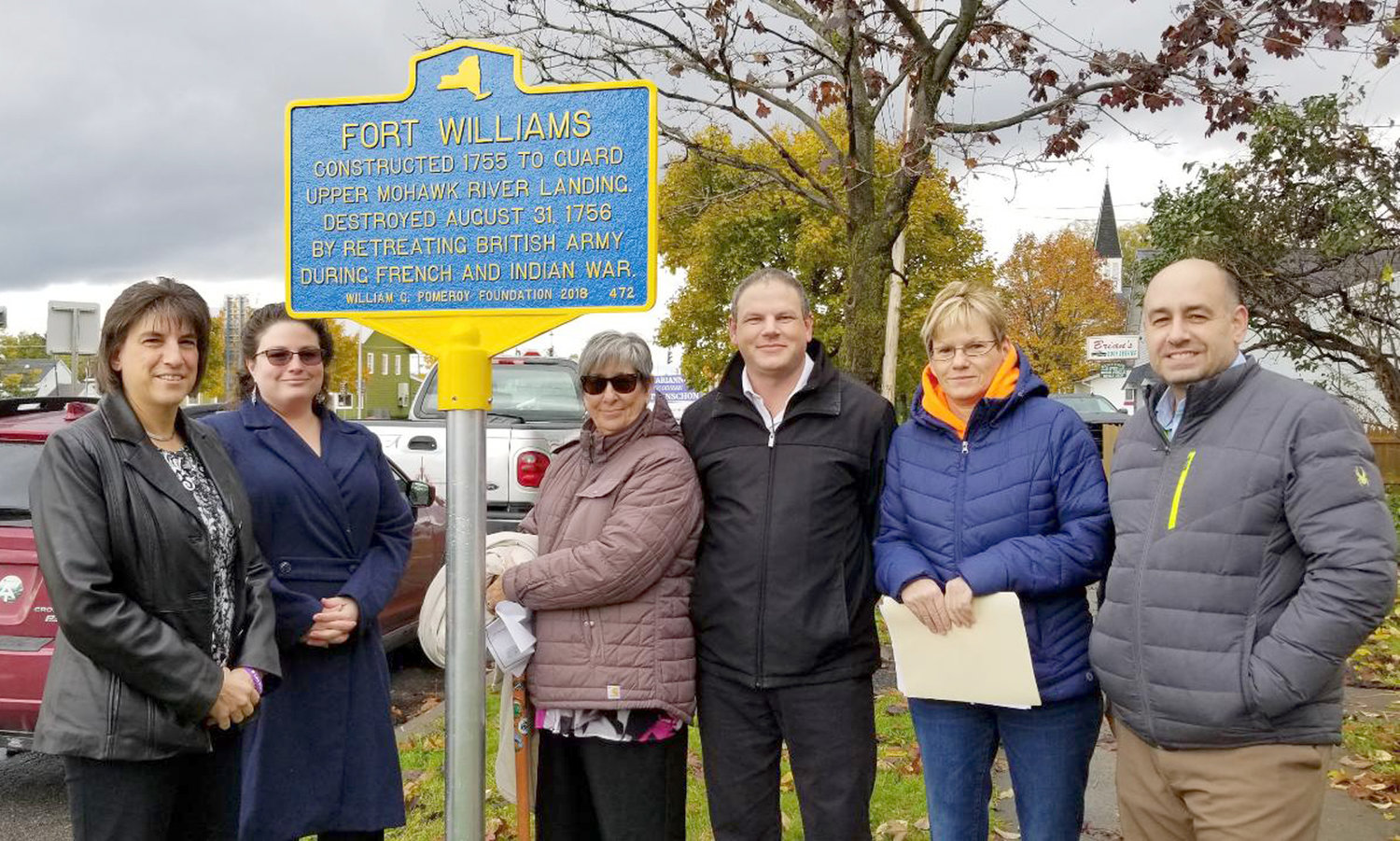 SIGN OF OLD TIMES — City officials and members of the local historical community gathered to unveil a pair of historical markers on East Whitesboro Street in Rome earlier this week.  The markers, which pay homage to a pair of colonial forts, Fort Williams and Fort Craven, both destroyed during the French and Indian War. On hand to celebrate the event were, from left: Mayor Jacqueline M. Izzo, Cabryn Gurdo, chair of the Historic Preservation Advisory Committee of Rome; Bobbie O’Brien, Rome Historical Society trustee and HPAC member; Arthur L. Simmons III, Rome Historical Society executive director; Patricia Grucza, HPAC member; and Ric Dursi, 6th Ward councilor.