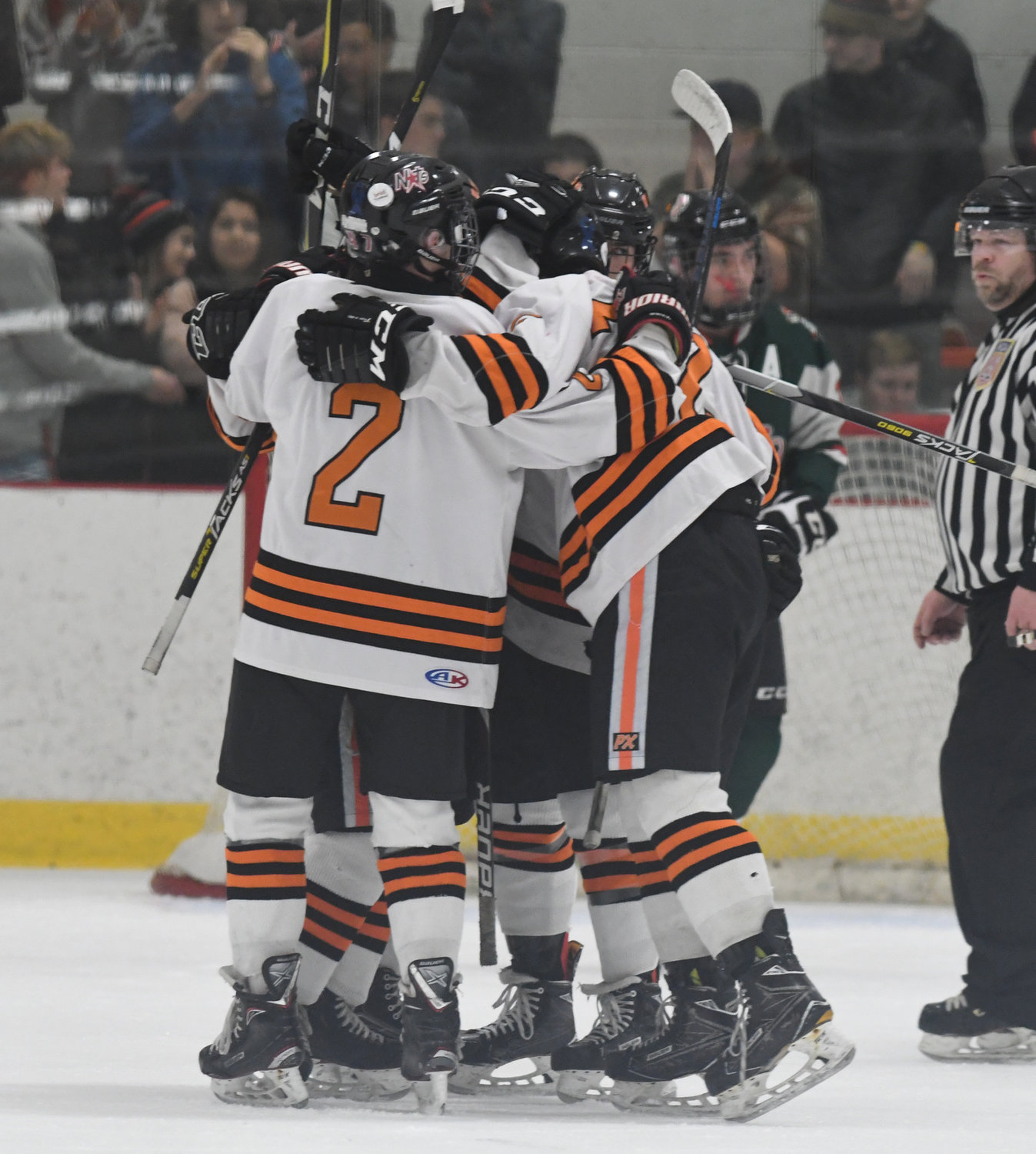 FIRST BLOOD — Rome Free Academy players celebrate the team’s first goal Friday night at Kennedy Arena against Fulton. Captain Danny Mecca scored on the power play to get the scoring started en route to a 4-1 win.