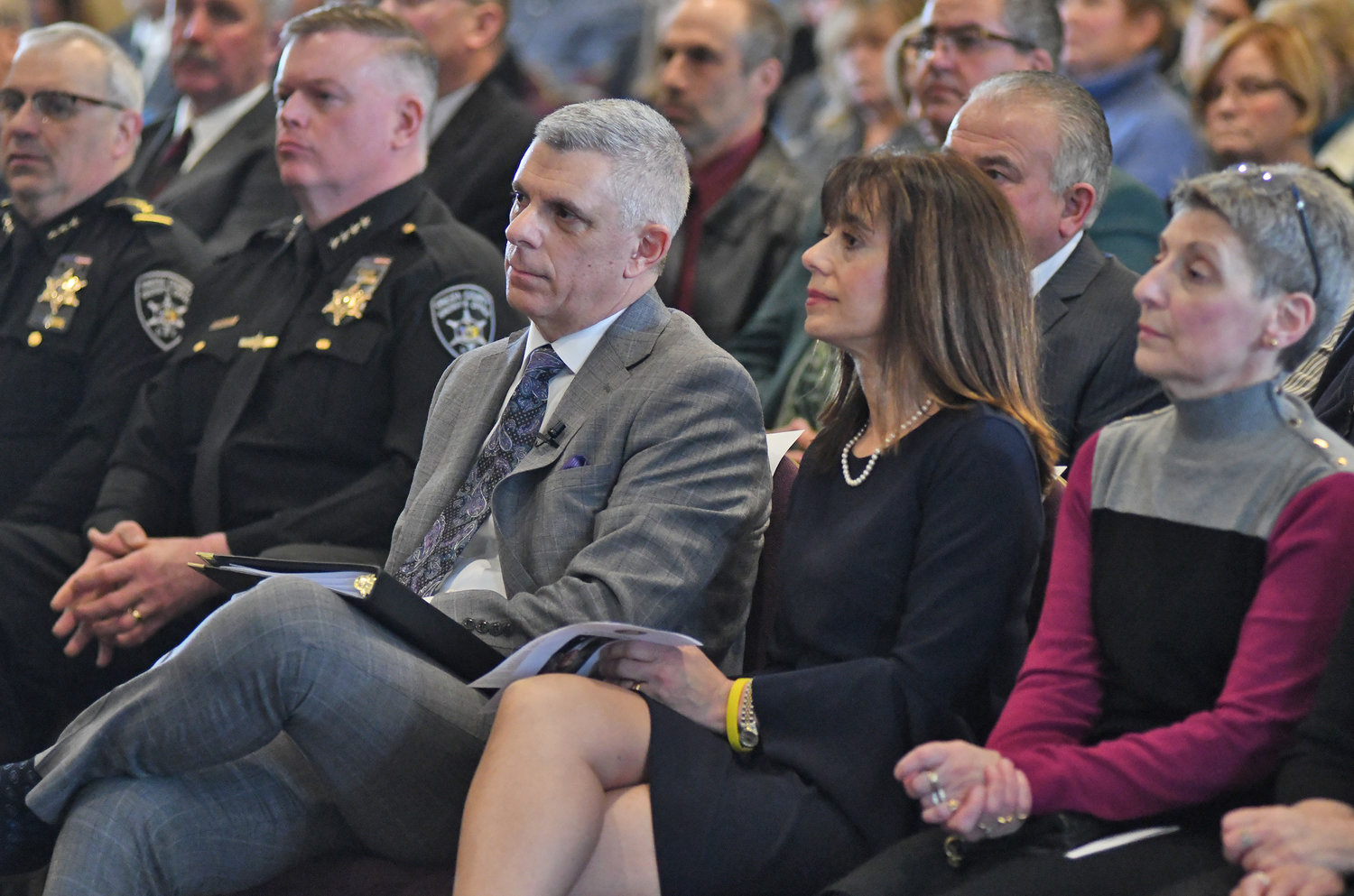 County executive Anthony Picente during his state of the county speech Tuesday afternoon. His wife Eleanor is to his left one of of his sisters.