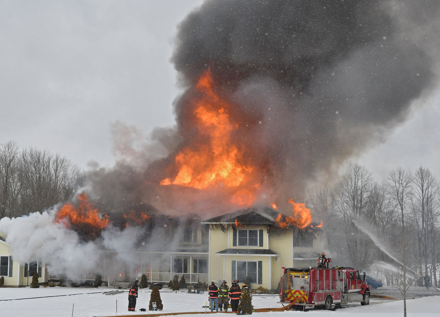 HEAVY FLAMES — The home at 4327 Wood Creek Road in Verona was engulfed in flames this morning as multiple volunteer fire departments were on the scene, with additional engines, tankers and manpower called in.