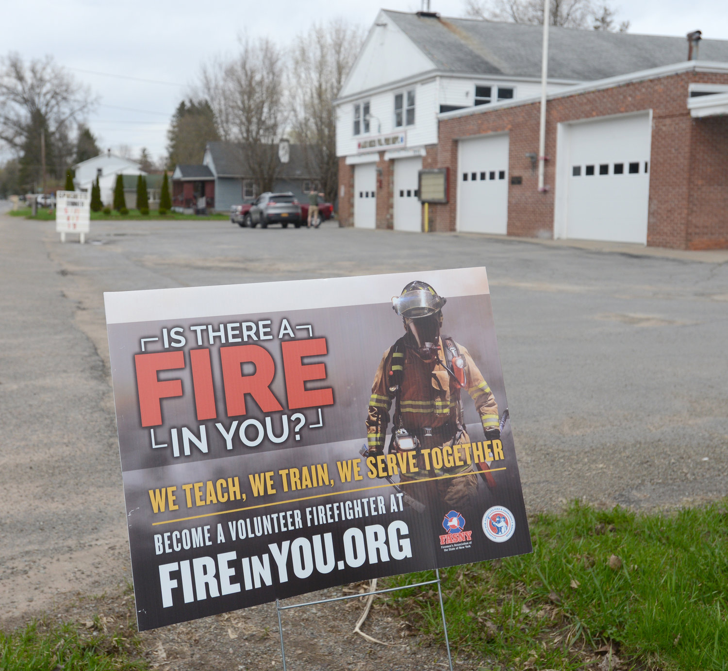 RECRUITNY — A sign in front of the Lake Delta firehouse on Elmer Hill Road seeks to entice new volunteers. Lake Delta is one of nearly two dozen fire departments across the county holding an open house this weekend as part of the RecruitNY effort.
