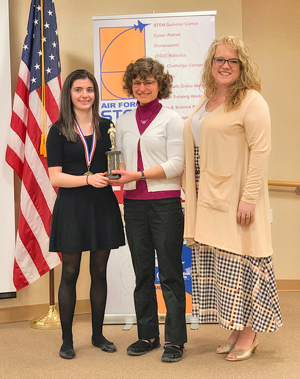 AFRL CHALLENGE COMPETITION WINNERS — Members of the Clinton High School team that won the AFRL (Air Force Research Laboratory) Challenge Competition, from left: students Jessica Ritz and Kim Rivera; and teacher Laura Broccoli.
