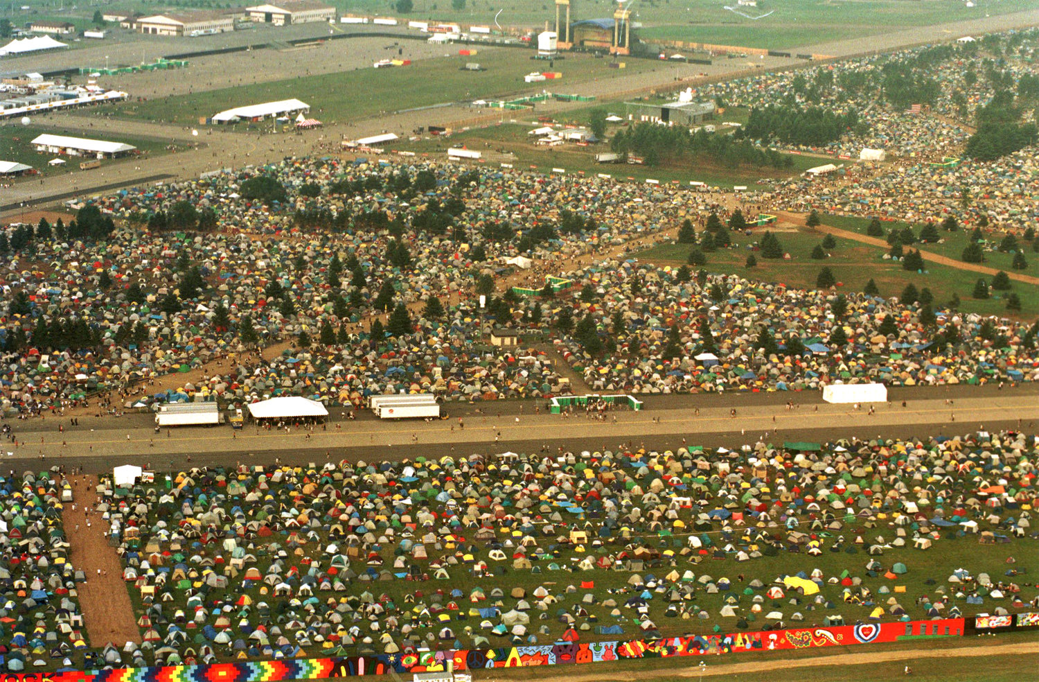Arerial of Woodstock '99 campgrounds and the West Stage at the top of the photo.