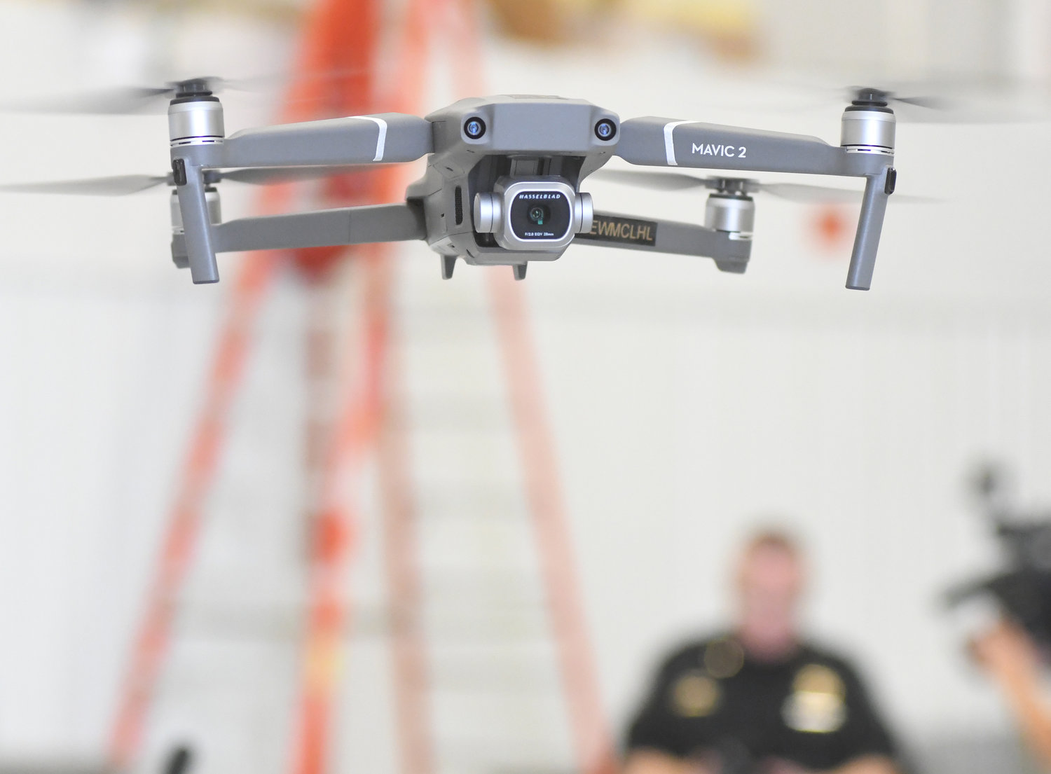 UP, UP AND AWAY — A Mavic Pro drone hovers a few feet above ground as part of Sheriff Robert M. Maciol’s new drone unit rollout this morning. This battery-powered camera drone is one of eight in the new fleet, and costs about $1,000.
