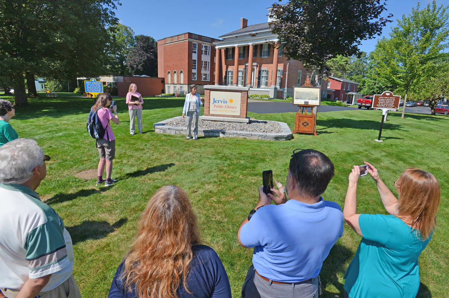 CITY SIGNIFICANCE — Mayor Jacqueline M. Izzo talks about the new historical markers at the Jervis Public Library and their importance to the city during a ceremony on the library grounds Tuesday.