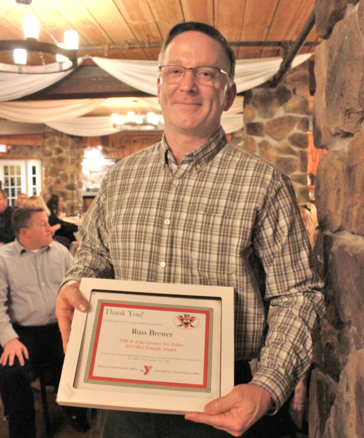 RED TRIANGLE — Russ Brewer was awarded the Red Triangle at the annual YMCA 2020 Recognition Program on Wednesday.