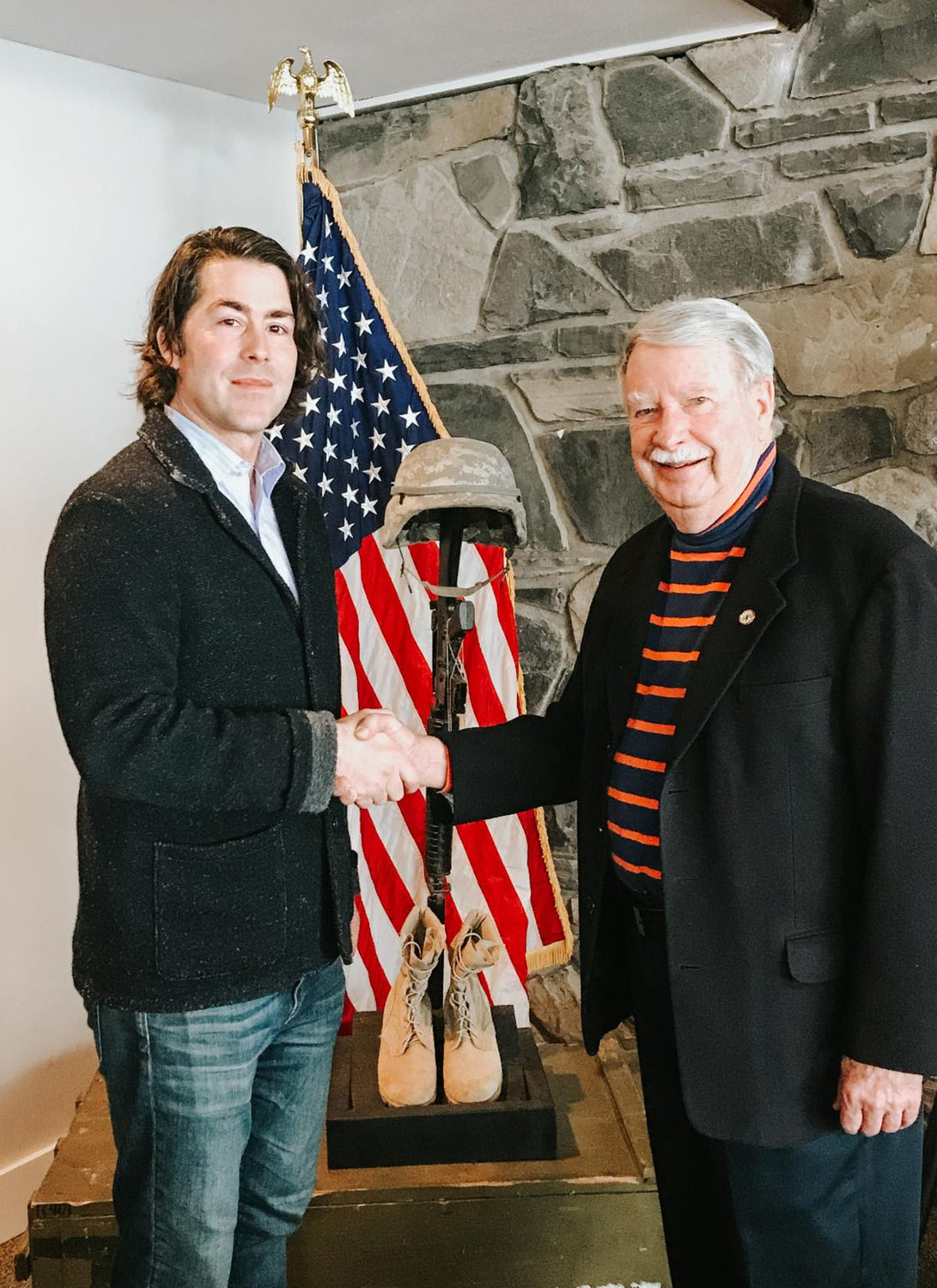 HISTORIC HELP — Garrett Law, left, shakes hands with Clear Path for Veterans CEO Bill Smullen. Law recently acquired “This Old Church”, formerly the Vernon Center Presbyterian Church and has undertaken the task of restoring it.