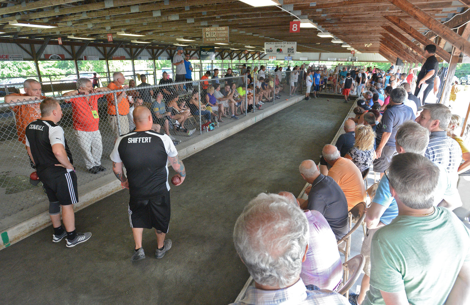 FULL HOUSE — Bocce fans gather around to watch Mellace’s Legal Eagles take on Val’s Sporting Goods at the World Series of Bocce during the 2019 competition. The annual event, which draws hundreds of teams and thousands of spectators, will not be held this year.