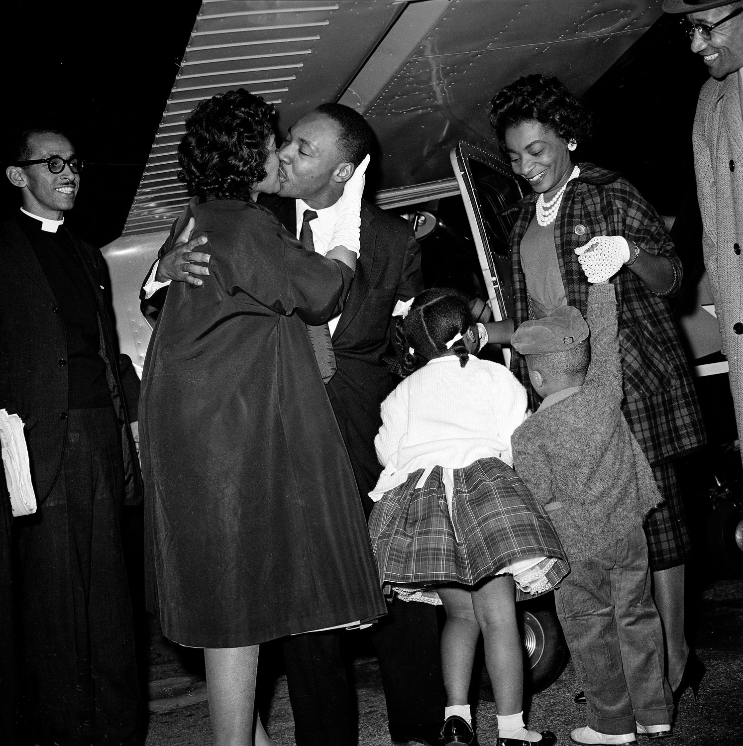 FILE - In this Oct. 27, 1960 file photo, Martin Luther King Jr. is given a kiss by his wife Coretta as he is welcomed back from Georgia's Reidsville State Prison by demonstrators and family gathered at the DeKalb Peachtree Airport. Following the publication of "An Appeal for Human Rights" on March 9, 1960, students at Atlanta's historically black colleges waged a nonviolent campaign of boycotts and sit-ins protesting segregation at restaurants, theaters, parks and government buildings. (AP Photo, File)
