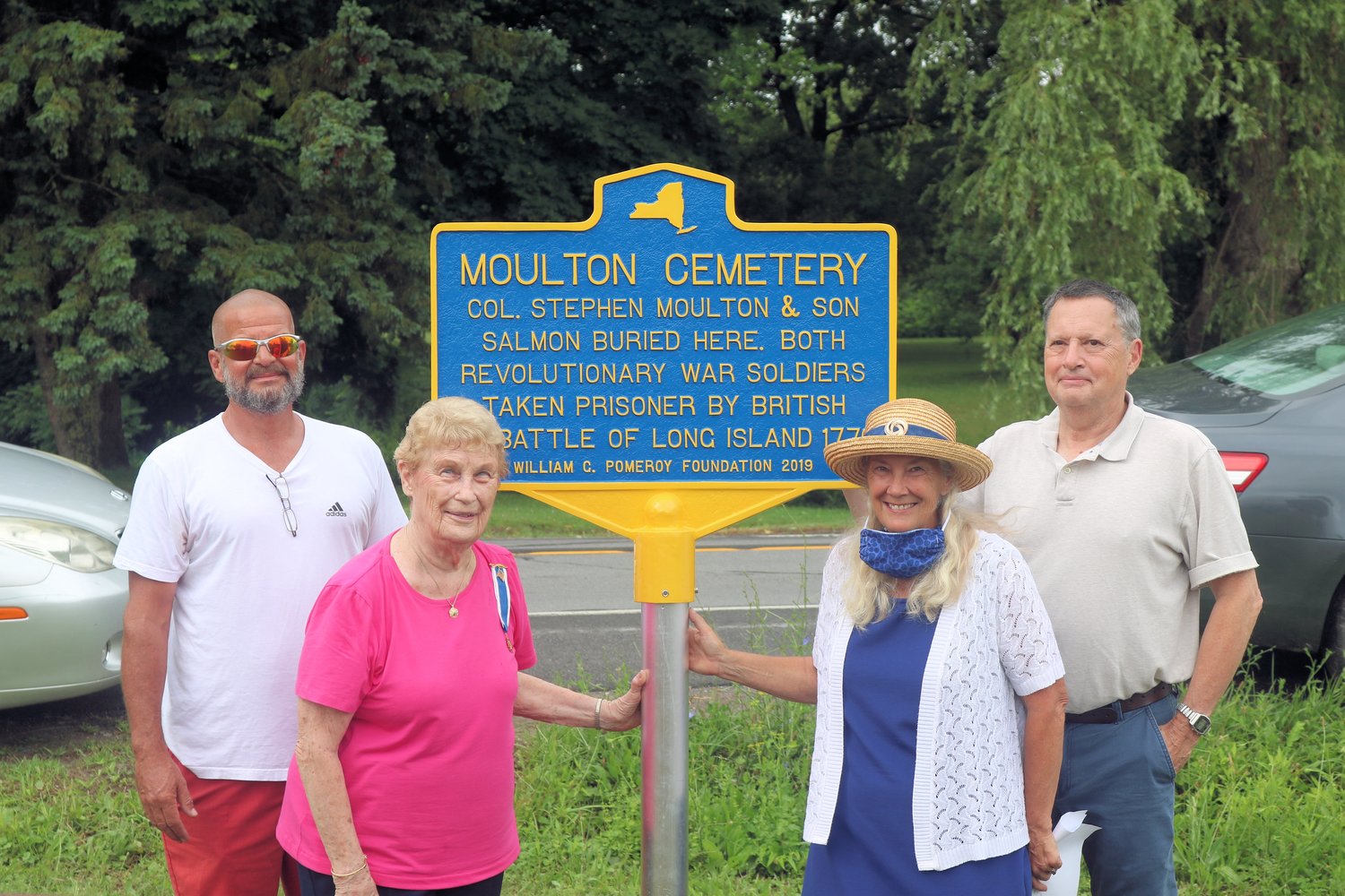 PATRIOTS HONORED — Members of the Holland Patent Chapter of the Daughters of the American Revolution and guests unveil a historical marker to honor Revolutionary War patriots Col. Stephen Moulton and his son, Salmon, during a recent ceremony.  From left: Michael Kelly, Moulton homestead owner; Beverly Seifried, DAR chapter regent; Kitty Squire, DAR chapter vice regent; and Jeff Moulton, a family descendant.