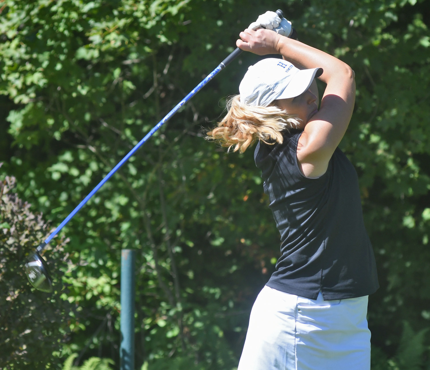 HOLDING THE FOLLOW THROUGH — Lauren Cupp tees off on the ninth hole at Rome Country Club on Monday morning at the Rome City Women’s Amateur Golf Tournament. Cupp won the Open Division shooting a 74.