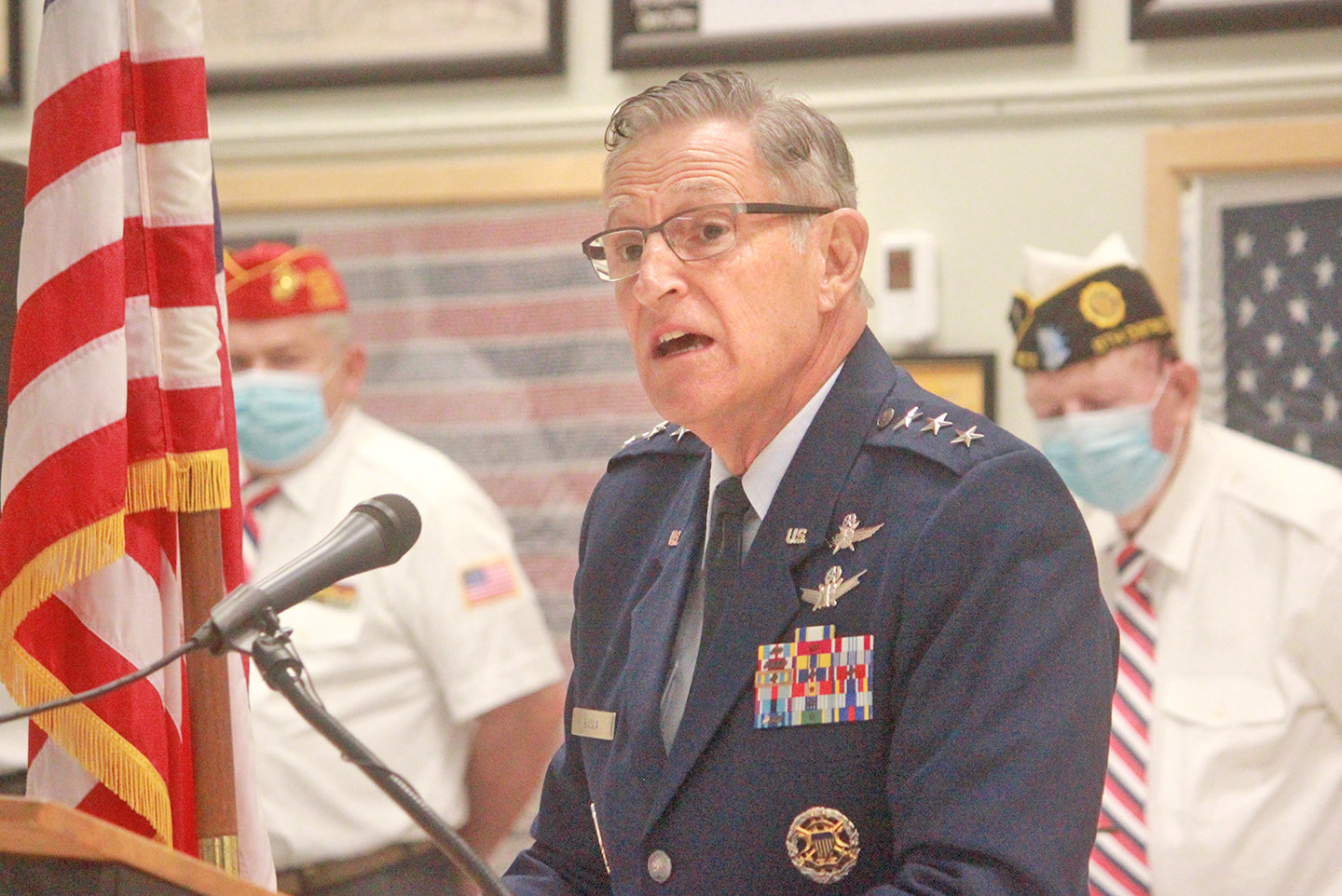 STORIES LEFT TOLD — Lt. Gen. Michael Basla speaks today at the Madison County War Veterans Memorial Committee's Veterans Day ceremony. Basla urged residents across the region to reach out to their community veterans, speak with them, learn from them, and hear their untold stories.